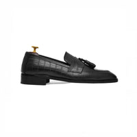 Black tassel loafer, side profile
