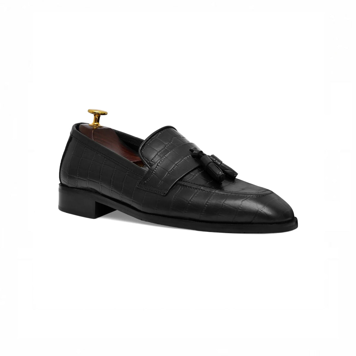 Black tassel loafer, angled view