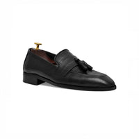 Black tassel loafer, angled view