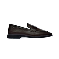 Dark brown penny loafer, side profile